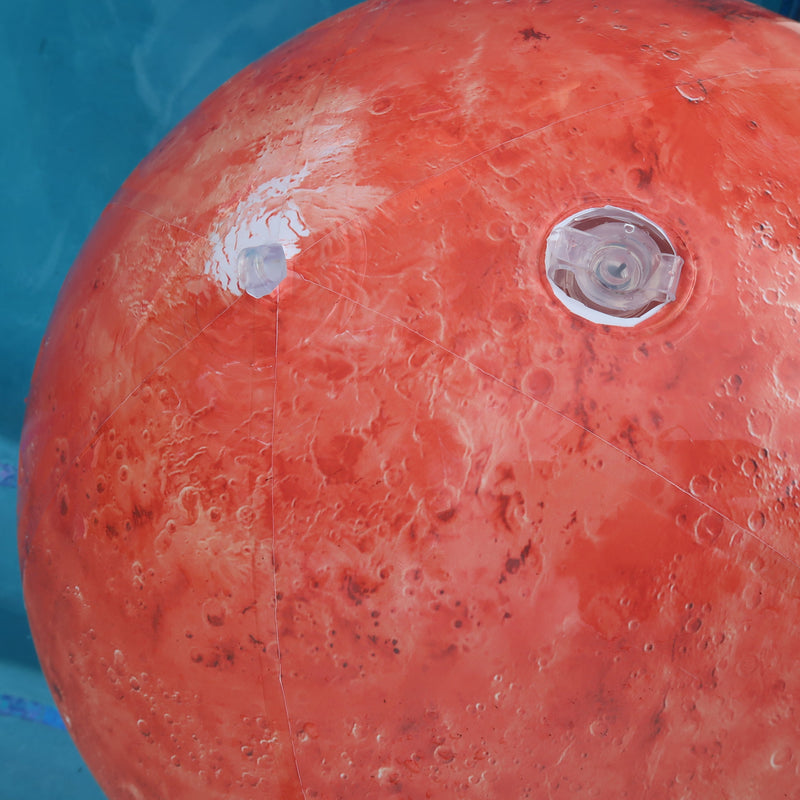 Close-up of a red buoy with a metal cap in a pool