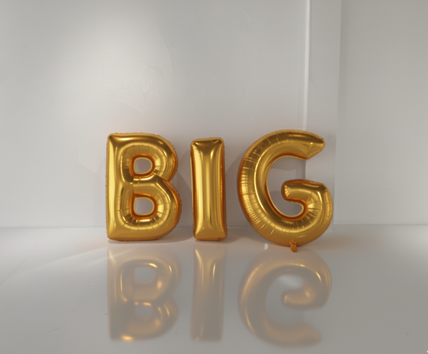 Gold inflatable letters spelling 'BIG' on a white background