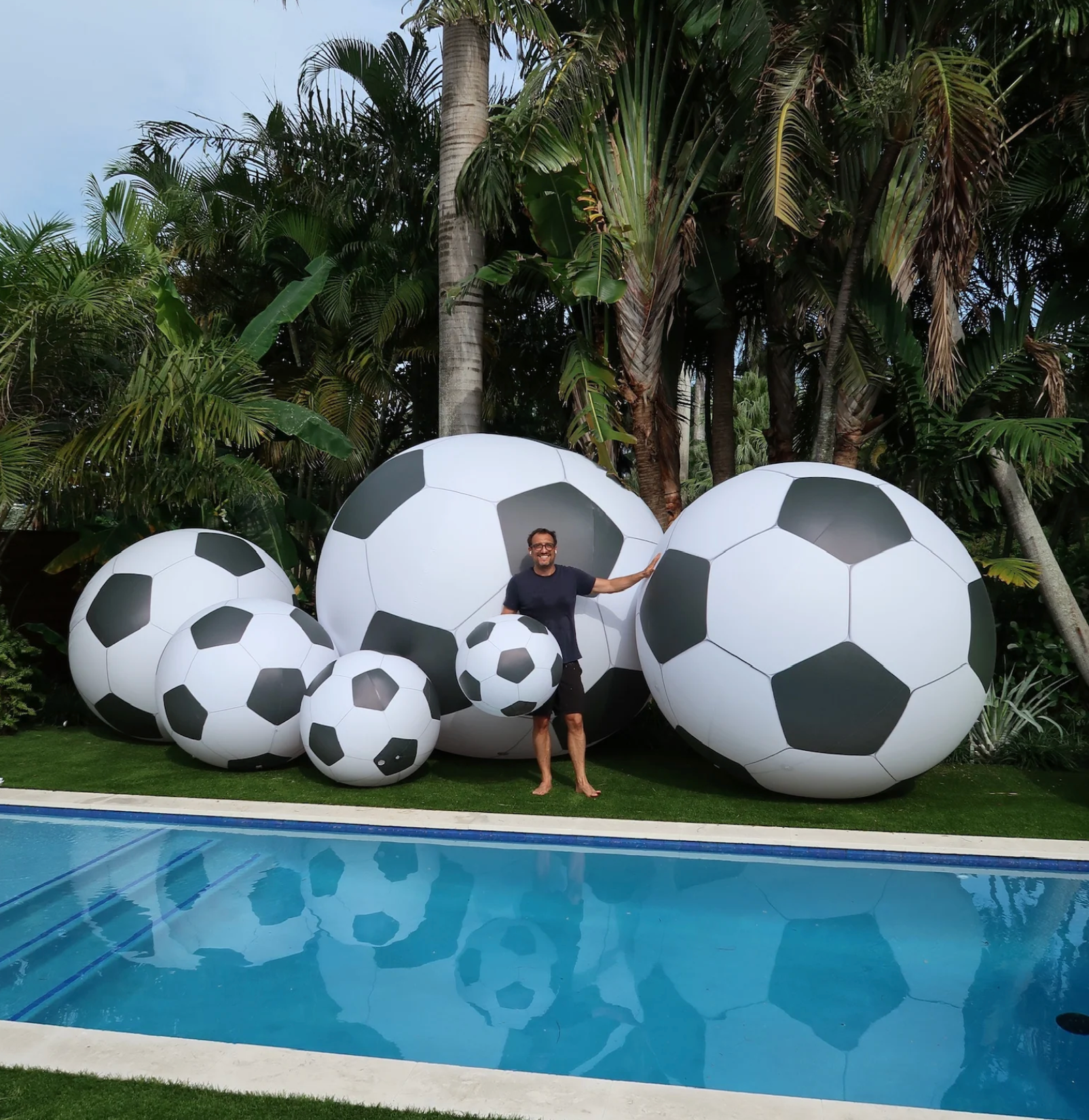 Giant inflatable soccer balls multiple sizes backyard pool World Cup display