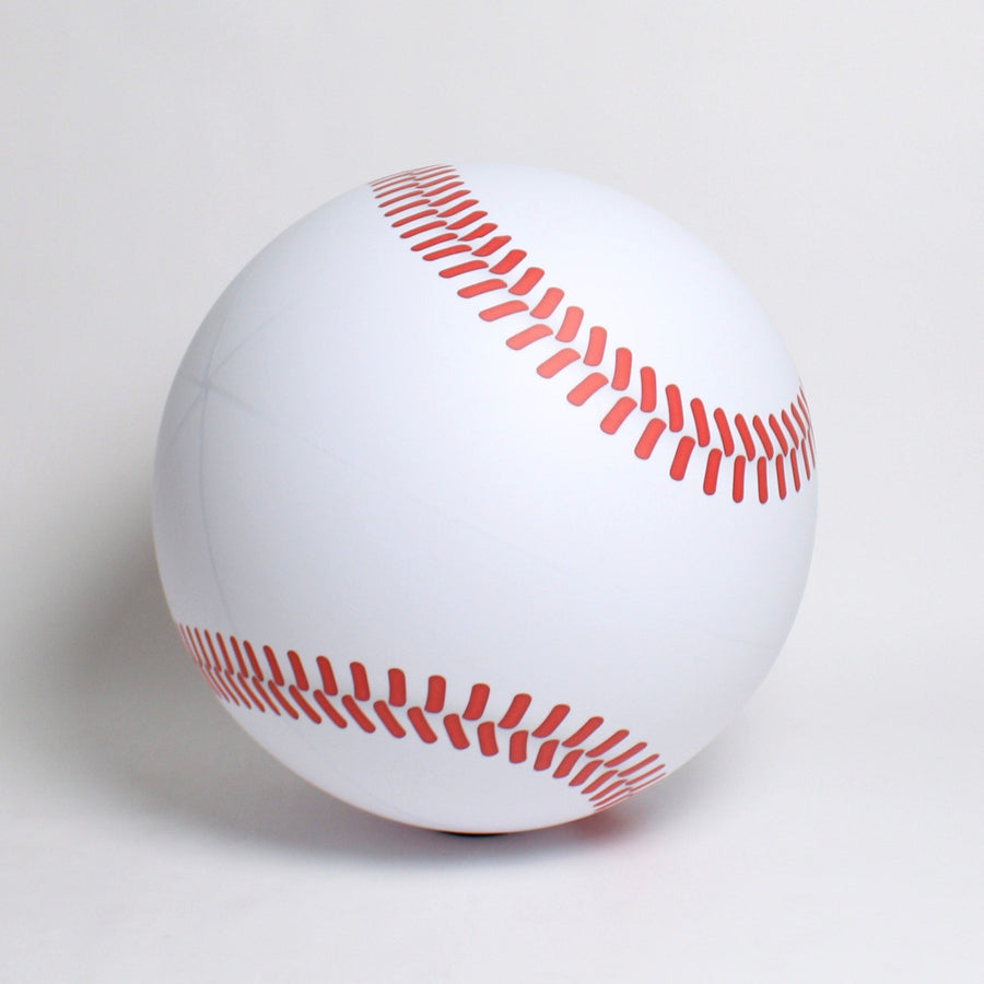 Baseball with red stitching on a white background